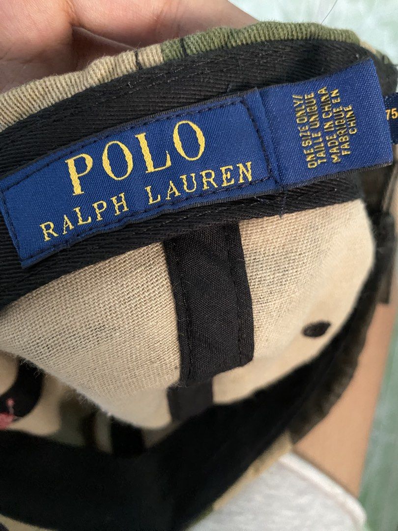 Polo Ralph Lauren Camou (Category: Caps & Hats) located in Tigaon. Submitted by rap2k (Listing ID 1442351559, Image 3). Description: - Classic camouflage baseball cap by Polo Ralph Lauren - Features iconic red Polo player logo embroidery on the front - Adjustable strap at the back for a custom fit - One size fits most - Ideal for casual and everyday wear.