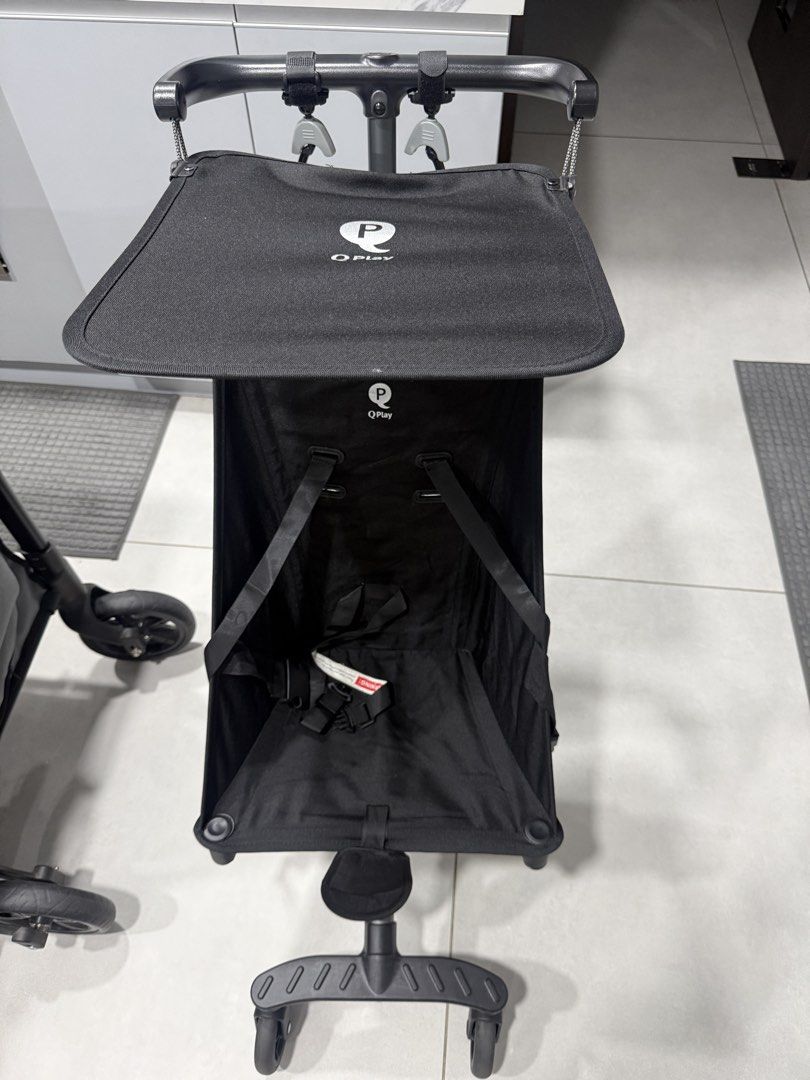 Q Play Stroller Compact Lightweight Travel Stroller (Category: Strollers) located in Quezon City. Submitted by anya_cruz (Listing ID 1442463596, Image 1). Description: - Compact and lightweight black Q Play stroller - Effortless maneuverability with swivel wheels - Secure 5-point harness for child's safety - Adjustable canopy for sun protection - Folds compactly for easy storage and travel - Ideal for families on the go.