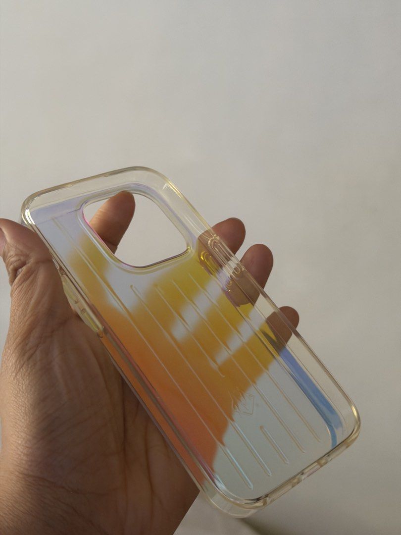 Rimowa Iridescent Case for Iphone 15 Pro (Category: Cases & Sleeves) located in Quezon City. Submitted by oggoodsph (Listing ID 1442372502, Image 3). Description: Selling as is! :) I used this once in my 15Pro Still good as new 2k fixed.