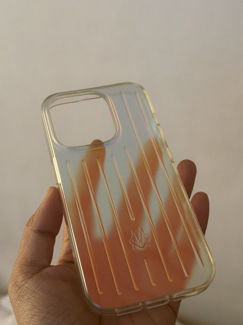 Rimowa Iridescent Case for Iphone 15 Pro (Category: Cases & Sleeves) located in Quezon City. Submitted by oggoodsph (Listing ID 1442372502, Image 1). Description: Selling as is! :) I used this once in my 15Pro Still good as new 2k fixed.
