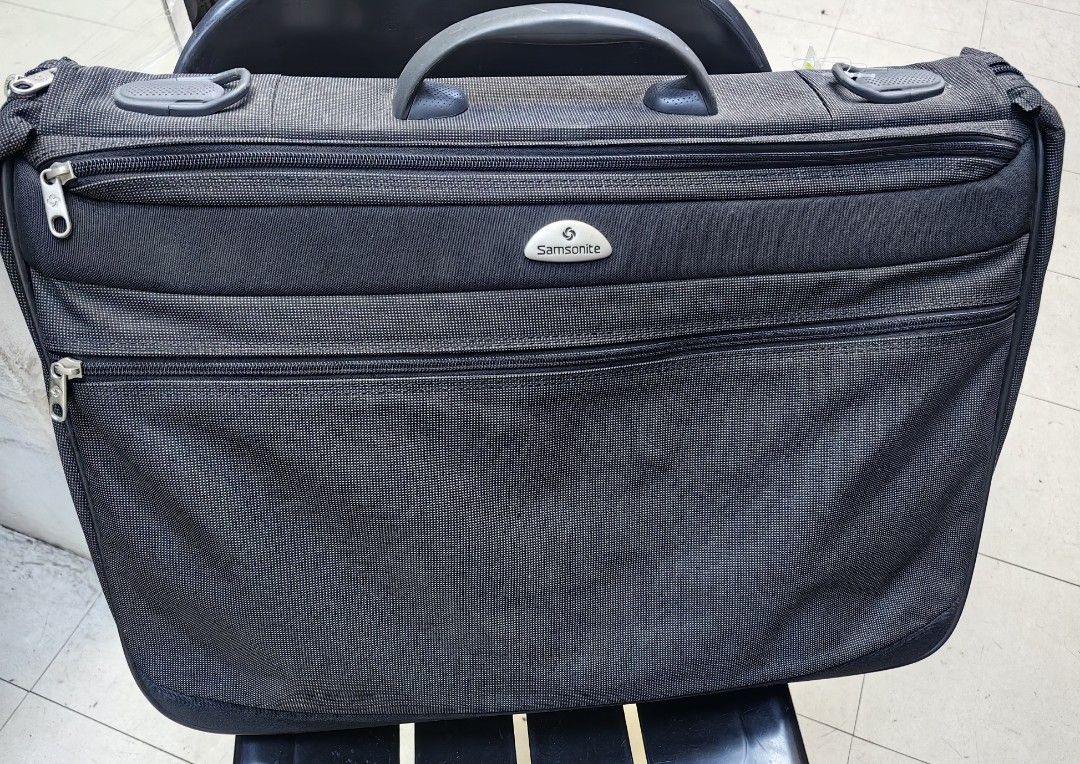 Samsonite Gray Garment Bag Suit Carrier (Category: Briefcases) located in Quezon City. Submitted by flat.earther23 (Listing ID 1442443840, Image 1). Description: - Samsonite garment bag in gray fabric. - Ample interior space for suits and shirts. - Includes a hangers - Zippers are fully functional. - Sturdy handle for comfortable carrying. - Ideal for travel or long-term storage. - Folds compactly for convenient transport. - sling missing.
