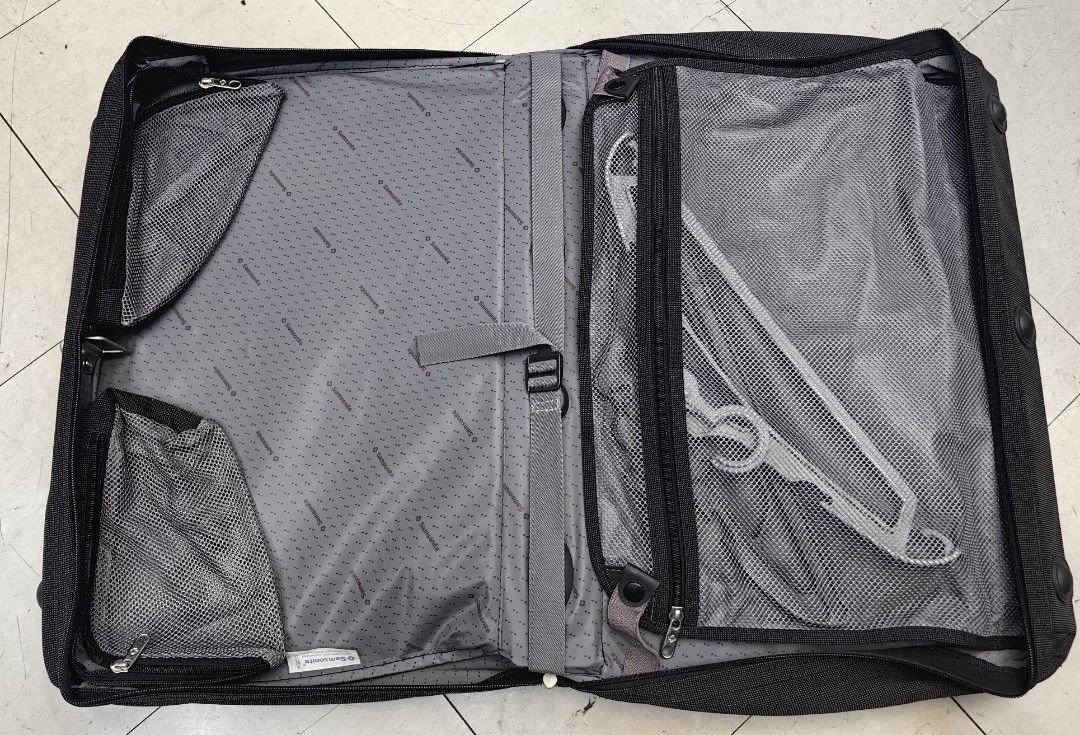 Samsonite Gray Garment Bag Suit Carrier (Category: Briefcases) located in Quezon City. Submitted by flat.earther23 (Listing ID 1442443840, Image 3). Description: - Samsonite garment bag in gray fabric. - Ample interior space for suits and shirts. - Includes a hangers - Zippers are fully functional. - Sturdy handle for comfortable carrying. - Ideal for travel or long-term storage. - Folds compactly for convenient transport. - sling missing.