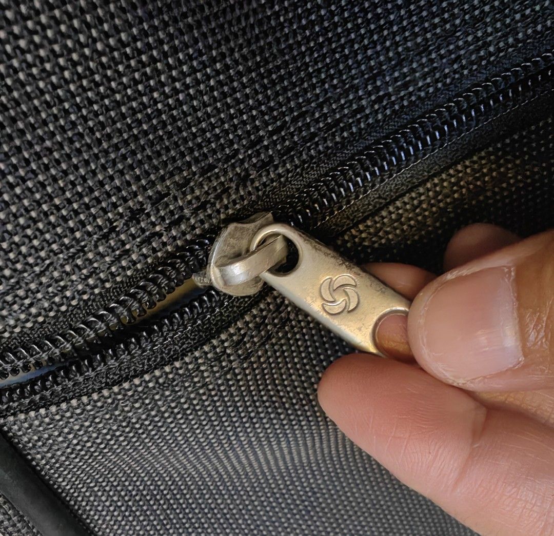 Samsonite Gray Garment Bag Suit Carrier (Category: Briefcases) located in Quezon City. Submitted by flat.earther23 (Listing ID 1442443840, Image 2). Description: - Samsonite garment bag in gray fabric. - Ample interior space for suits and shirts. - Includes a hangers - Zippers are fully functional. - Sturdy handle for comfortable carrying. - Ideal for travel or long-term storage. - Folds compactly for convenient transport. - sling missing.
