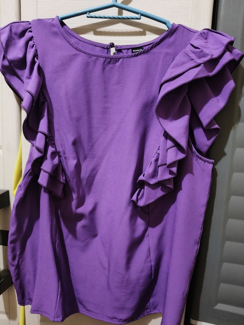 SHEIN Purple Ruffle Sleeve Top Size M (Category: Blouses) located in Marikina City. Submitted by lorence11 (Listing ID 1442519351, Image 1). Description: - Brand: SHEIN - Color: Purple - Features: Cute ruffle details on sleeves - Neckline: Round - - - Pairing: Easily matches with jeans or skirts.