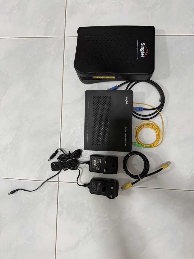 Singtel Optical Network Router and a Singtel WiFi Gigabit Router AC Plus.