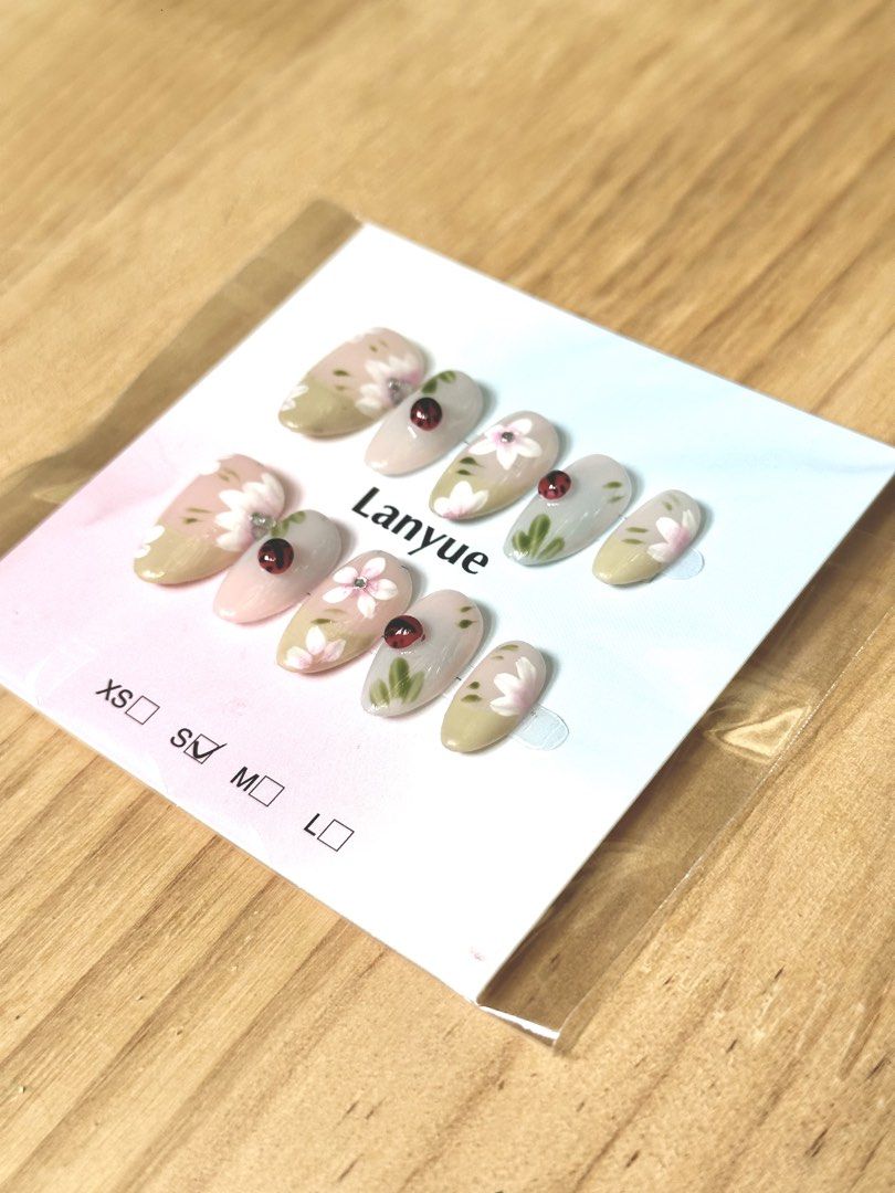 Size S • Floral with 3D Lady Bug Press-On Nails • Short Almond Shape (Category: Hands & Nails) located in Quezon City. Submitted by lycheebasket (Listing ID 1442435308, Image 2). Description: ❣️Buy 6 nails, get the lowest price for FREE (pay only 5 of your 6 picks) ❣️ ✨ Short almond shape press-on nails ✨ Design: 3D lady bug, simple flat flowers, subtle pink and green color ✨ Size: S ✨ Comes with FREE jelly glue and nail file ✨ 150 + shipping fee