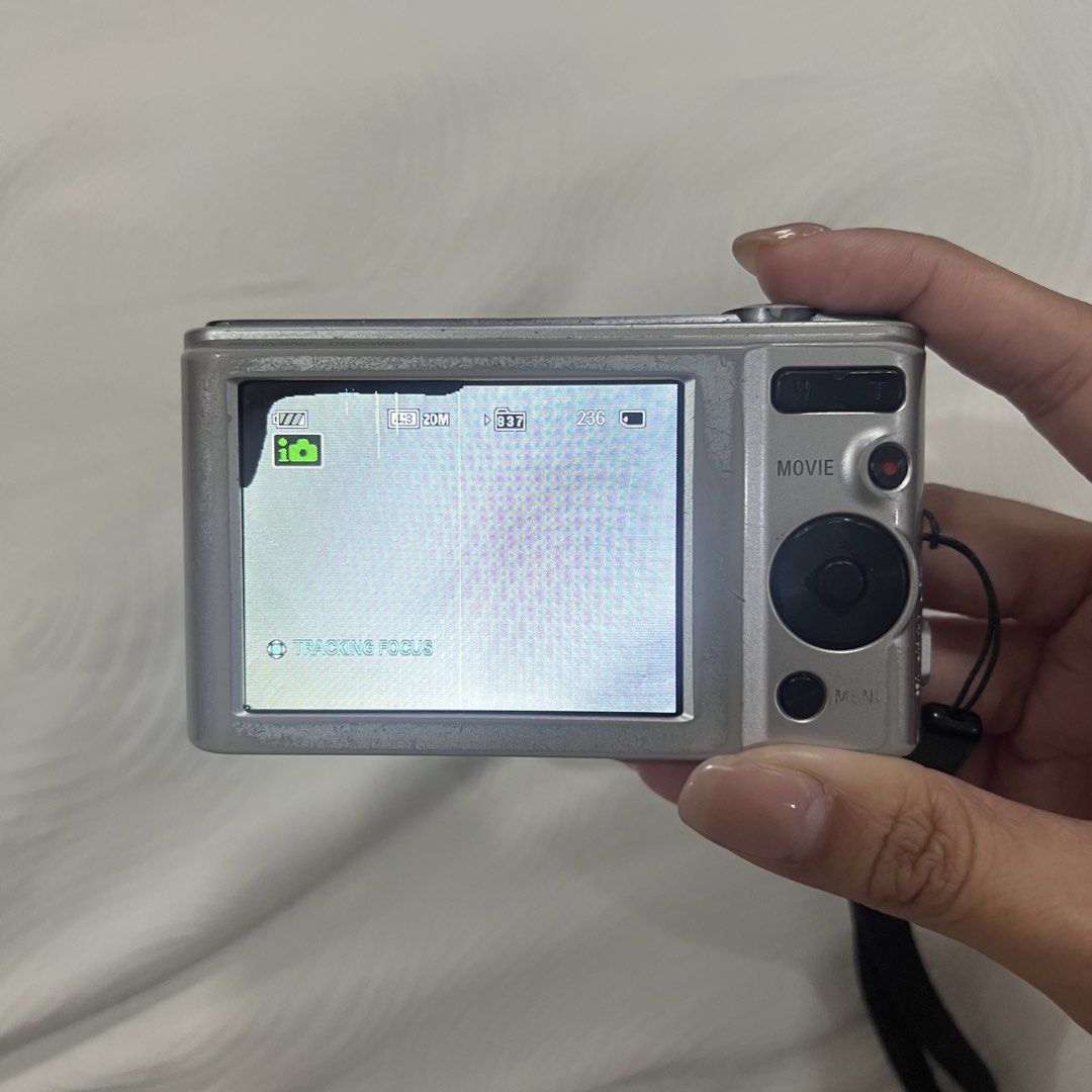 Sony Cybershot DSC W800 Digital Camera Digicam (Category: Cameras) located in Iloilo. Submitted by aradeclutters (Listing ID 1442517692, Image 3). Description: Location: Iloilo Bought second-hand last December 2025 from FB marketplace. Condition: All buttons working Flash and video working Issues: - Lens curtain needs to be manually closed - Lens dust when zoomed - LCD line & black part (doesn’t affect output) Inclusions: unit, battery, memory ca