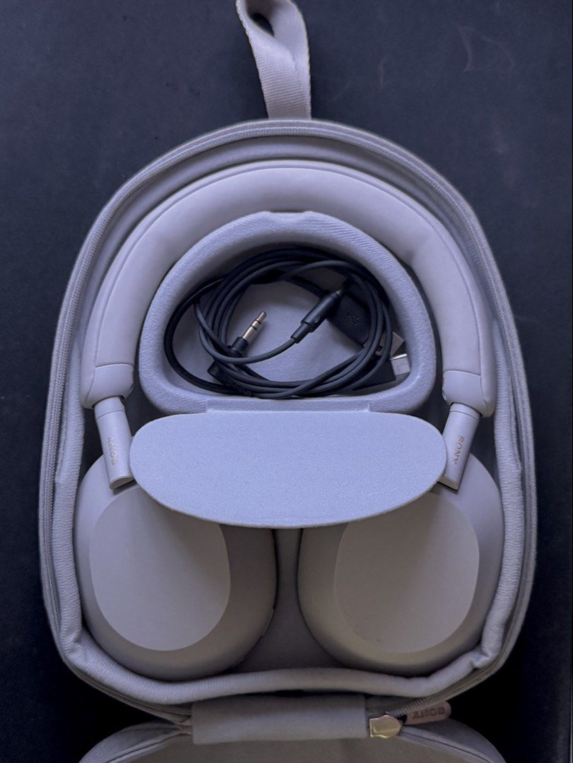 Sony XM5 (Category: Headphones & Headsets) located in Taguig. Submitted by edvll (Listing ID 1442535838, Image 1). Description: Condition: Light use. Bought for 21k at the time of release but never really used it. Preferred using airpods over headphones. Selling for 11,000 php (slight negotiable) Reason for selling: Decluttering. Need funds. Inclusions: Case and charger cord Location : Manila/Makati/Taguig For delivery: Buyer will shoulder the fe