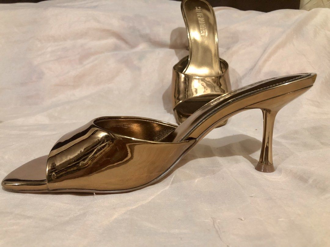 Steve Madden Bronze Metallic Square Toe Heeled Mules (Category: Heels) located in Quezon City. Submitted by polluxfineshop (Listing ID 1442433128, Image 2). Description: - Brand: Steve Madden - Color: Gold Metallic - Style: Heeled Mules - Toe Shape: Square Toe - Closure: Slip-on - Features: Statement piece, easy to wear, moderate heel height - Size 7.5 US .