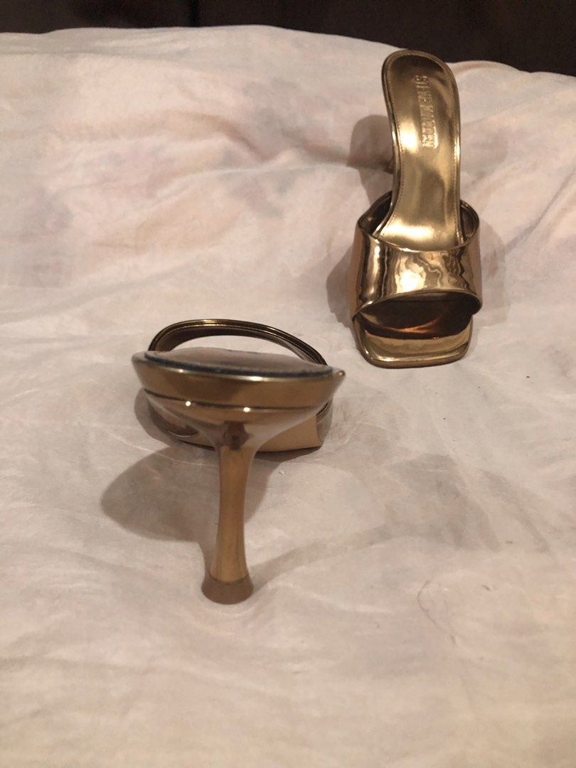 Steve Madden Bronze Metallic Square Toe Heeled Mules (Category: Heels) located in Quezon City. Submitted by polluxfineshop (Listing ID 1442433128, Image 3). Description: - Brand: Steve Madden - Color: Gold Metallic - Style: Heeled Mules - Toe Shape: Square Toe - Closure: Slip-on - Features: Statement piece, easy to wear, moderate heel height - Size 7.5 US .