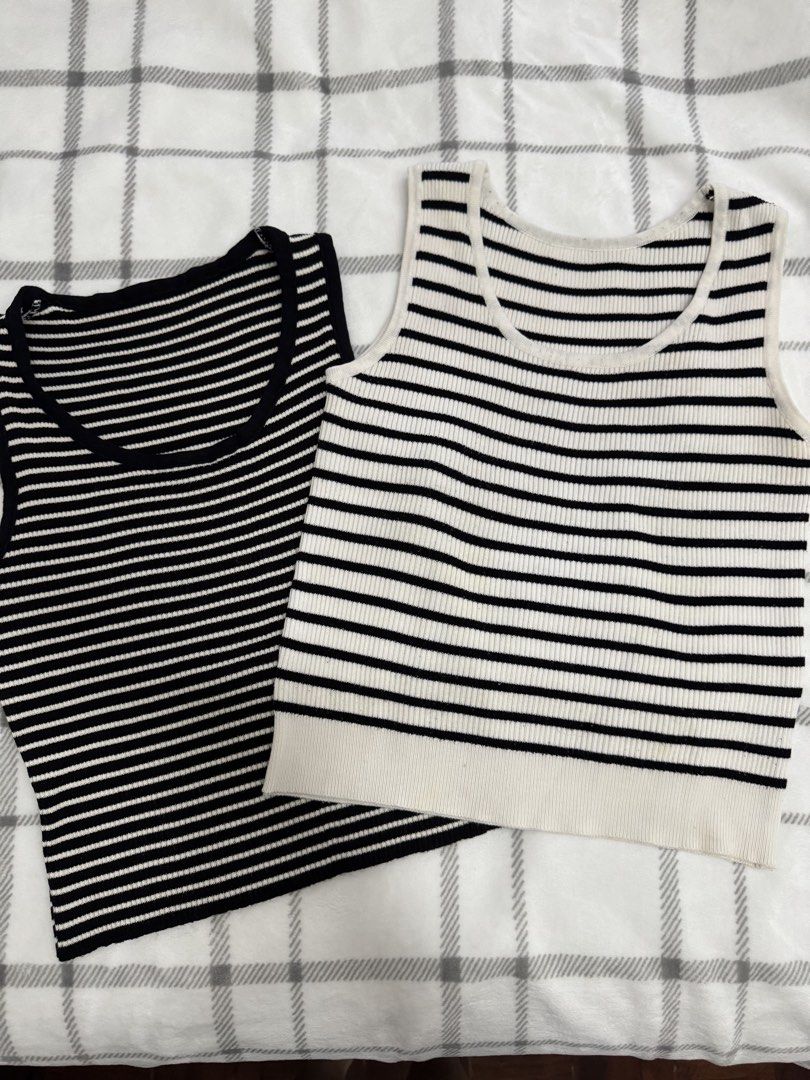 Striped Black and White Tank Tops (2 pcs) (Category: Sleeveless) located in Pasig City. Submitted by regden (Listing ID 1442378096, Image 1). Description: - Set of 2 ribbed knit tank tops - Colors: 1 Black with White Stripes, 1 White with Black Stripes - Features: Classic scoop neck, sleeveless design - Versatile: Great for layering or wearing on its own - Comfortable and easy to mix and match.