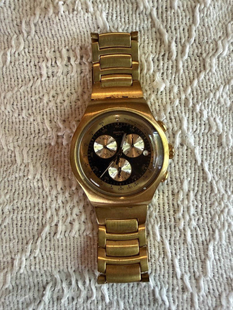 Swatch Irony Chronograph Gold Watch (Category: Men's Watches) located in Paranaque City. Submitted by izdeclutters (Listing ID 1442345874, Image 1). Description: - Gold Swatch Irony Chronograph watch Golden Block (YOG403G) model - Water-resistant - Features four jewels - Comes with original box - Needs new battery With original box With extra links .