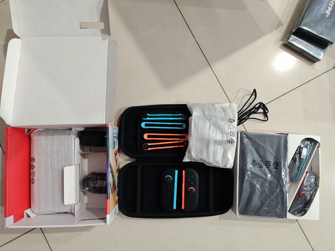Switch 2 (Category: Nintendo) located in Singapore. Submitted by vinlbw (Listing ID 1442402264, Image 2). Description: - Nintendo Switch 2 with screen protector - Original packaging included - Protective carrying case - Joy-Con * 4 - Charging cables - Excellent condition.