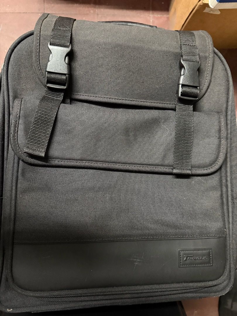 Targus Laptop Backpack (Category: Laptop Bags & Sleeves) located in Quezon City. Submitted by shopthebestbargains (Listing ID 1442372002, Image 1). Description: Used only a few times. Very sturdy with zippers, locks, backpack straps all intact. The color is black (not leather) but looks faded in the picture because of the lighting during the shoot. Selling to declutter..