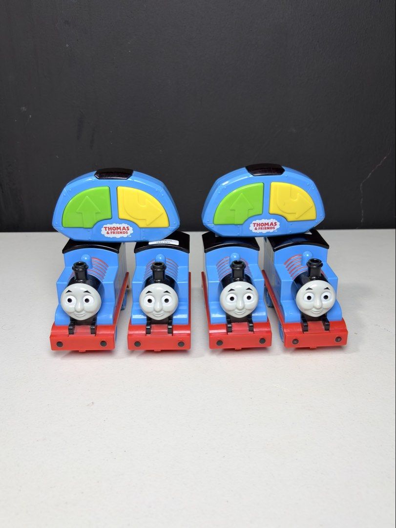 Thomas & Friends Remote Control Train Set (Category: Remote Control Toys) located in Manila. Submitted by biboystoyhouse (Listing ID 1442518486, Image 1). Description: - Thomas the Tank Engine remote control trains - Each train features a blue engine with a red base - Includes blue remote controls with yellow and green buttons SCO shipping - Ideal for Thomas fans and hours of fun playtime.