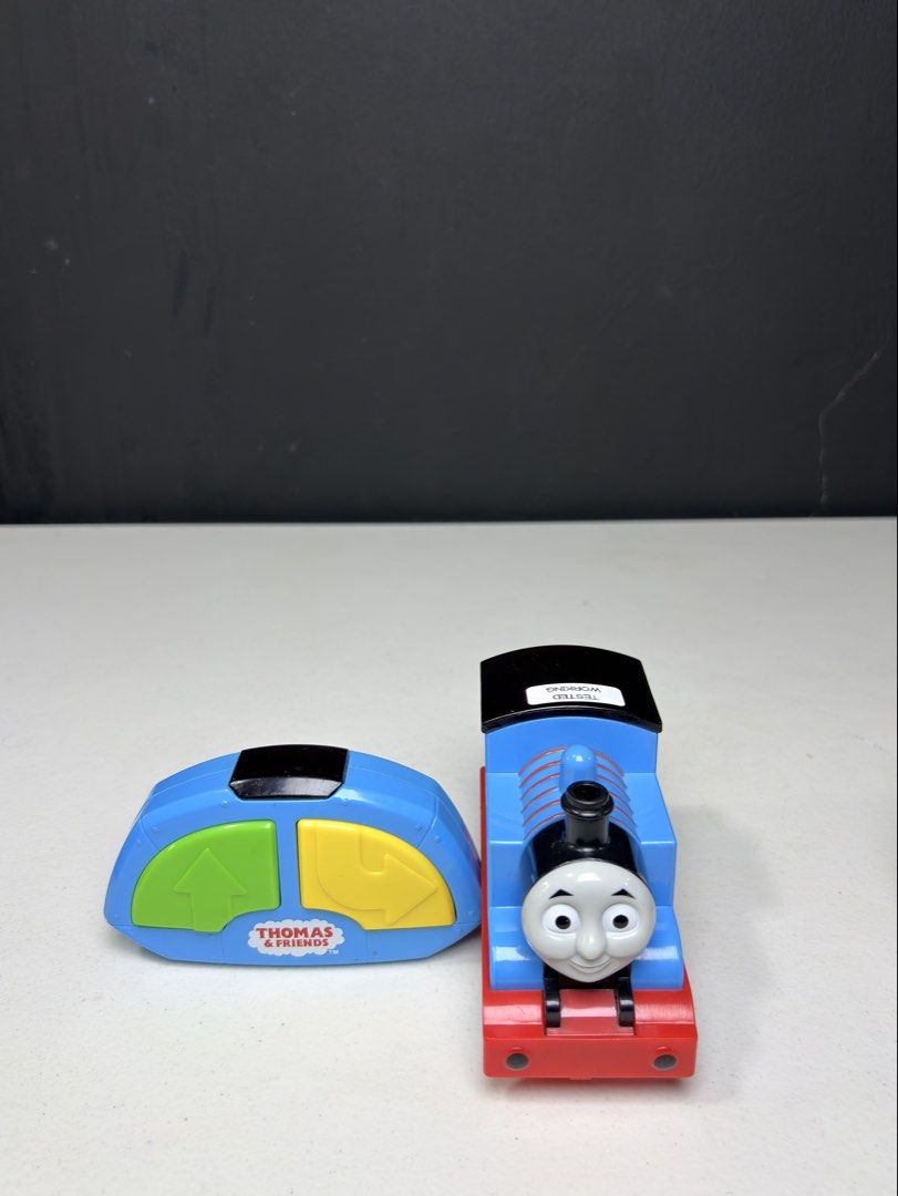 Thomas & Friends Remote Control Train Set (Category: Remote Control Toys) located in Manila. Submitted by biboystoyhouse (Listing ID 1442518486, Image 3). Description: - Thomas the Tank Engine remote control trains - Each train features a blue engine with a red base - Includes blue remote controls with yellow and green buttons SCO shipping - Ideal for Thomas fans and hours of fun playtime.