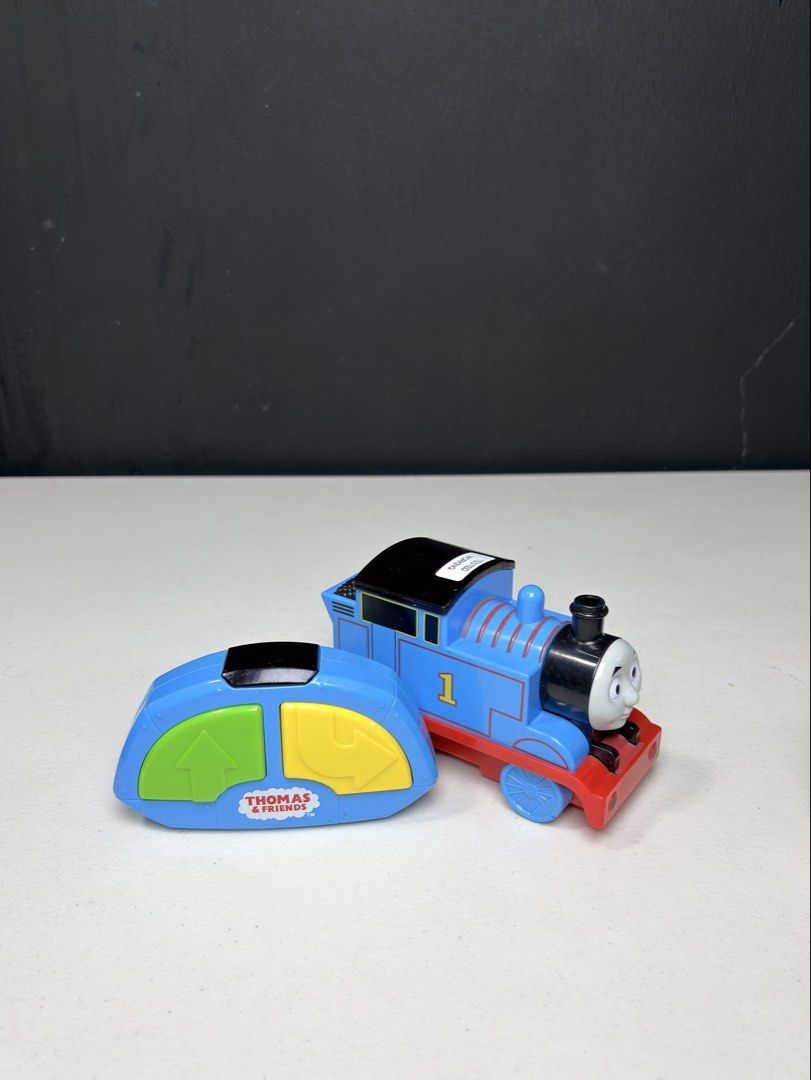 Thomas & Friends Remote Control Train Set (Category: Remote Control Toys) located in Manila. Submitted by biboystoyhouse (Listing ID 1442518486, Image 2). Description: - Thomas the Tank Engine remote control trains - Each train features a blue engine with a red base - Includes blue remote controls with yellow and green buttons SCO shipping - Ideal for Thomas fans and hours of fun playtime.