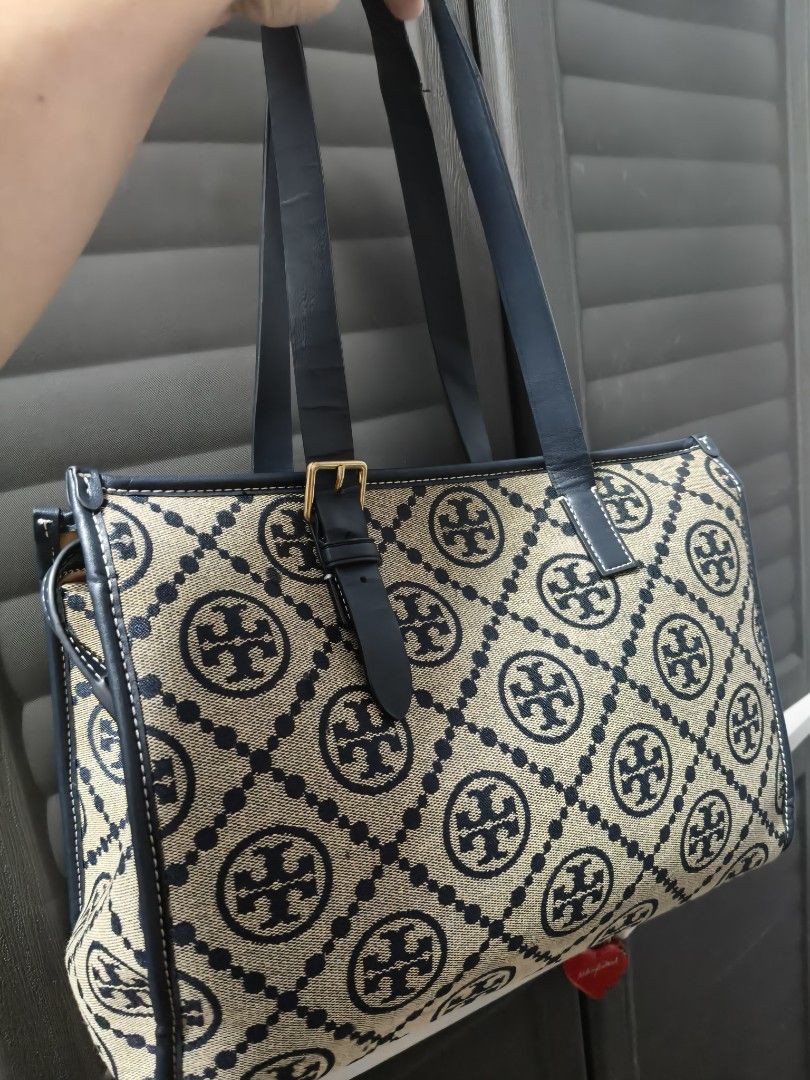 Tory Burch Monogram Canvas Leather Trim Tote Bag (Category: Tote Bags) located in Manila. Submitted by stuff_finder (Listing ID 1442363949, Image 2). Description: - Classic Tory Burch tote bag - Signature monogram canvas with navy leather trim - Secure top zipper closure - Interior zippered pocket and logo plate - Durable leather straps - Ideal for everyday use ykk zip.