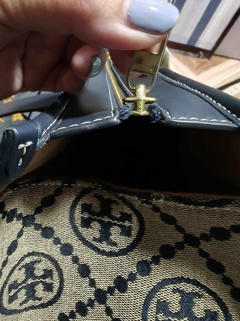 Tory Burch Monogram Canvas Leather Trim Tote Bag (Category: Tote Bags) located in Manila. Submitted by stuff_finder (Listing ID 1442363949, Image 3). Description: - Classic Tory Burch tote bag - Signature monogram canvas with navy leather trim - Secure top zipper closure - Interior zippered pocket and logo plate - Durable leather straps - Ideal for everyday use ykk zip.
