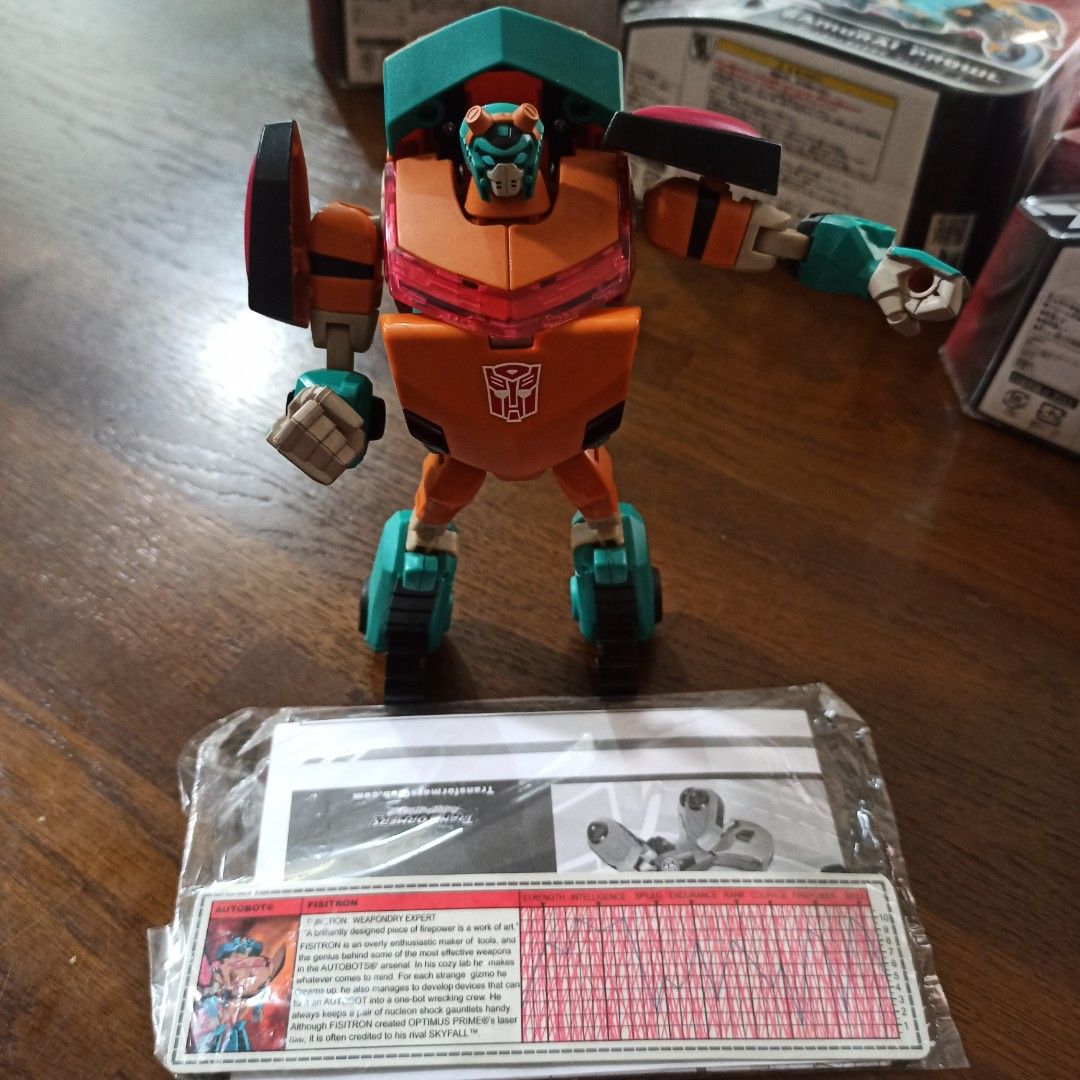 Transformers Animated Fisitron 2011 Botcon Exclusive with manuals (Category: Figurines & Statues) located in Paranaque City. Submitted by di.collector (Listing ID 1442398629, Image 2). Description: Remains one of the hardest-to-find official Animated mold variants in existence. Utilizing the excellent Animated Cybertronian Ratchet mold, this figure features Fisitron’s signature tan, teal, and black color palette, perfectly translating the fan-fav