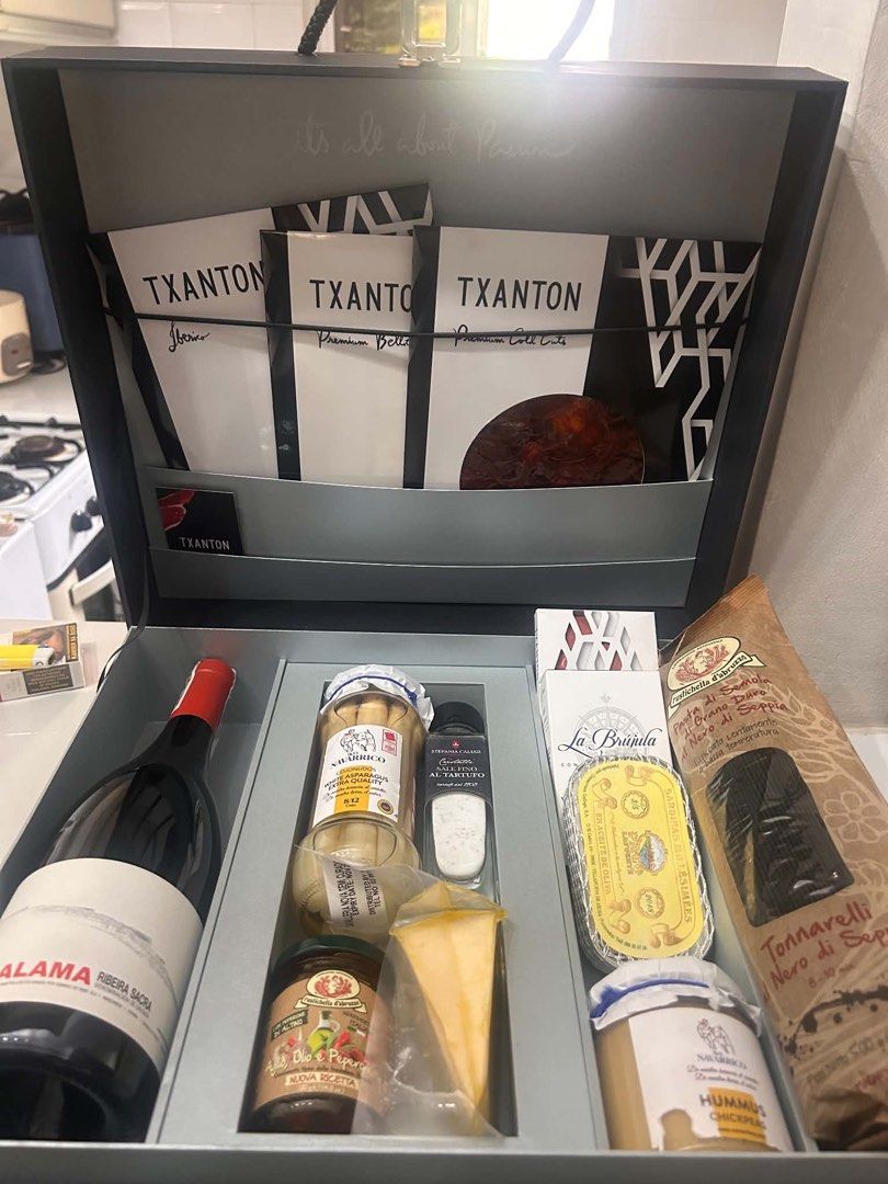Txanton Executive Suitcase (Category: Gift Baskets & Hampers) located in Manila. Submitted by styledbysha (Listing ID 1442541930, Image 1). Description: Set includes: - Wine lalama ribeira sacra 750ml - el navarrico white asparagus - cristalli sale fino al tartufo 100grams - aglio olie e peperoncino 130g - cheese cavalleria novasemi curado wedge - txanton wine chocolate - ventresca de atun claro - sardinas millesimees - hummus chickpeas - pasta d