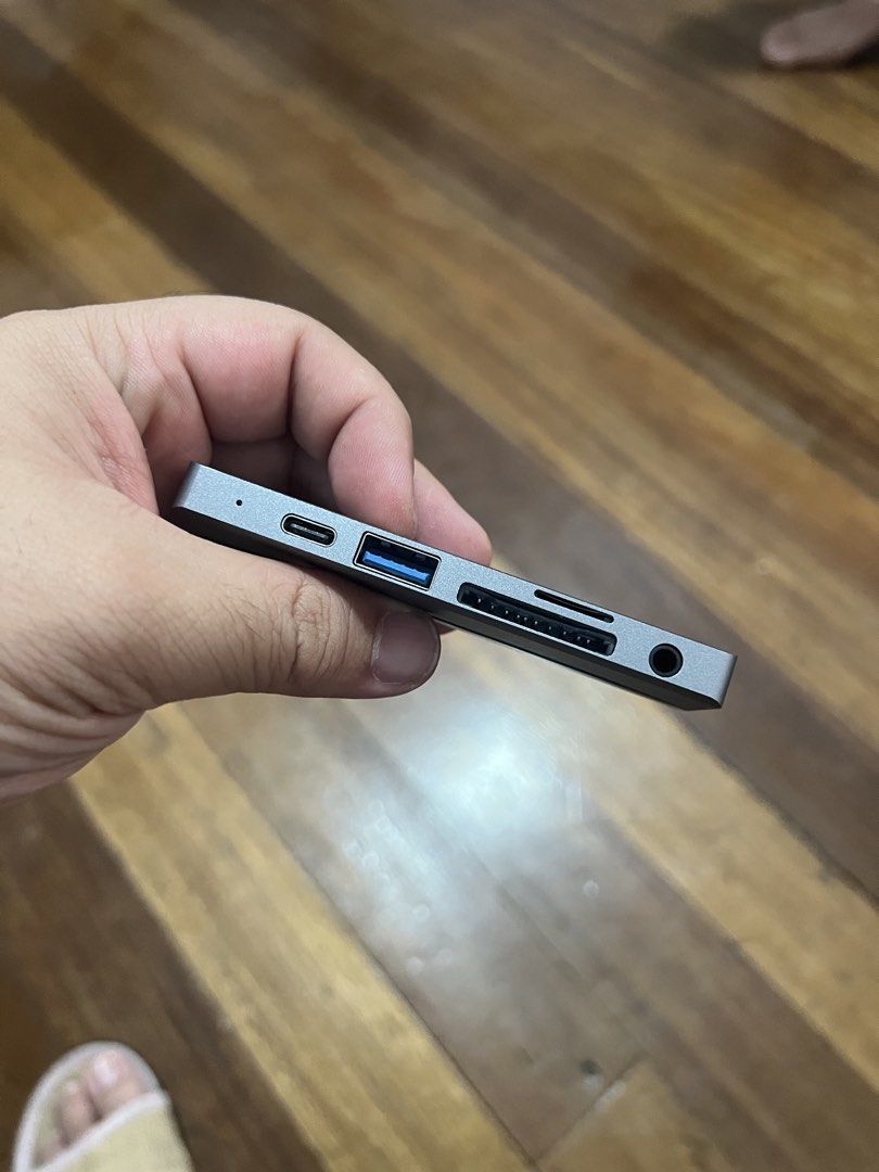 Type-C Adapter Hub with USB, HDMI, SD Card Reader (Category: Cables & Adaptors) located in Quezon City. Submitted by isa_timeless_treasures (Listing ID 1442370844, Image 2). Description: - Expand your laptop's connectivity with this versatile Type-C adapter hub. - Includes multiple ports: USB-A, USB-C, HDMI, and SD card slots. - Compact and portable design, perfect for on-the-go use. - Compatible with most USB-C enabled devices. - Enhance your te