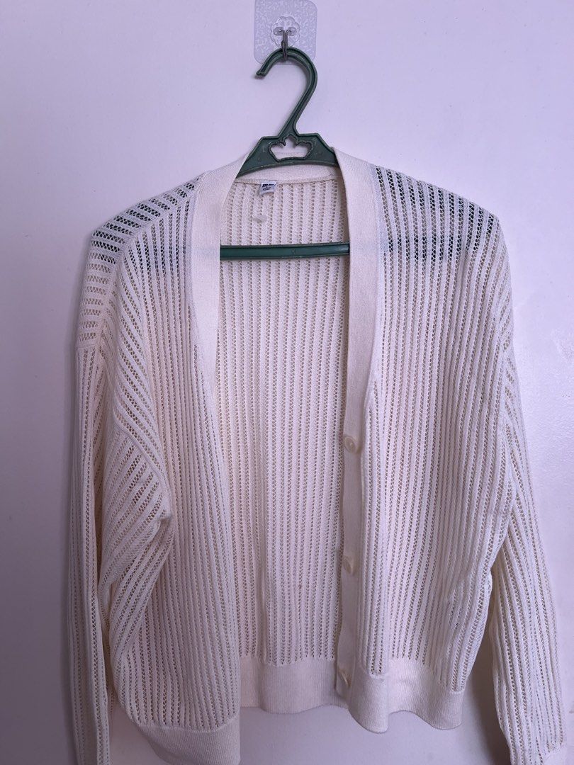 Uniqlo White Knit Cardigan (Category: Coats, Jackets and Outerwear) located in Manila. Submitted by chocoboruur (Listing ID 1442344948, Image 1). Description: - Uniqlo White Knit Cardigan - Lightweight and breathable material - Button-up front - Relaxed fit - Ideal for layering over tops or dresses - Versatile wardrobe staple.