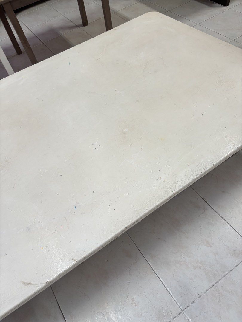 White Rectangular Coffee Table / Children’s Table / Floor Table (Category: Tables & Sets) located in Singapore. Submitted by rtan77 (Listing ID 1442414708, Image 3). Description: - White rectangular coffee table - Low profile design - Shows some scuffs and marks on the surface (from use) - Sturdy legs - Suitable for living room or study area - Approx. dimensions: 168cm length x 97cm width x 33cm height.