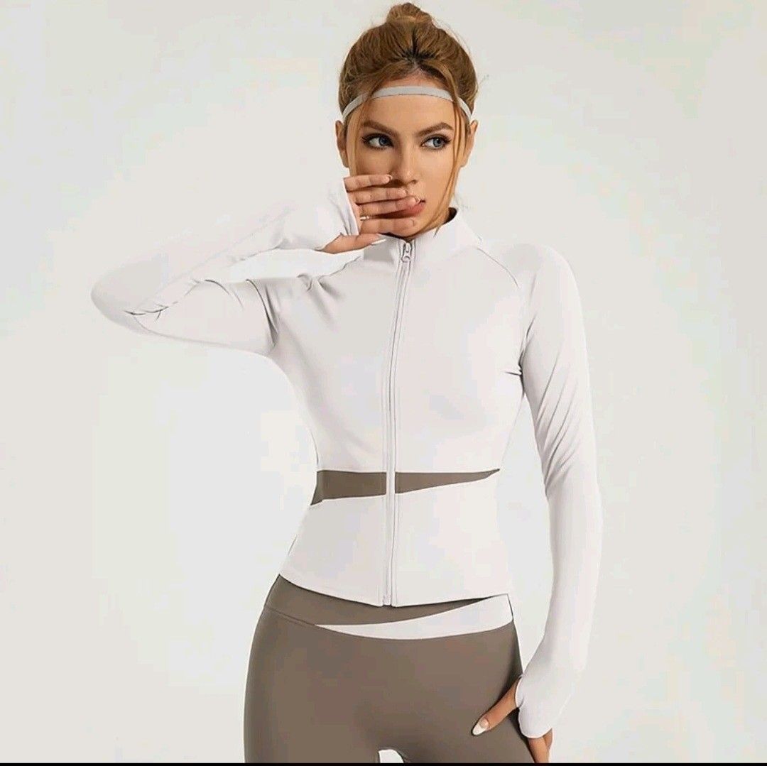 Women's Workout Set - Jacket & Leggings (Category: Activewear) located in Quezon City. Submitted by hannasalatan (Listing ID 1442488482, Image 1). Description: - Grey workout leggings - White zip-up jacket with thumbholes - Contrasting white and grey waist design on both pieces - Ideal for gym workouts or running errands - Please refer to the size chart for accurate measurements.