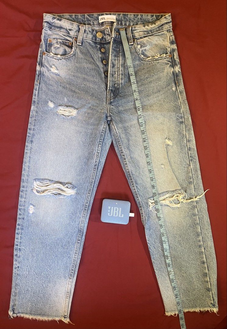 ZARA lightwash distressed denim jeans (Category: Jeans) located in Cebu City. Submitted by nerine888 (Listing ID 1442447209, Image 3). Description: Great casual pair of jeans. Used a few times and still like it's good as new Button Fly/Multi-button (not zipper) Please see pics for measurements.
