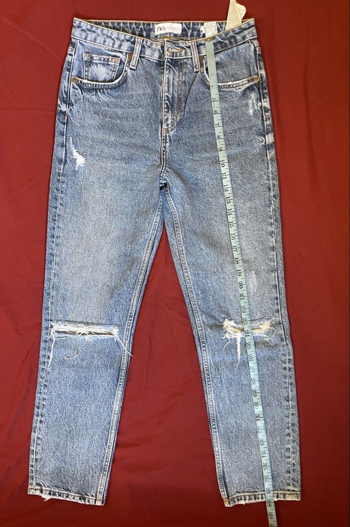 ZARA medium wash distressed denim jeans (Category: Jeans) located in Cebu City. Submitted by nerine888 (Listing ID 1442449665, Image 3). Description: Sturdy pair of jeans. Worn only a few times. Still feels structured and new. Please see pics for measurements.
