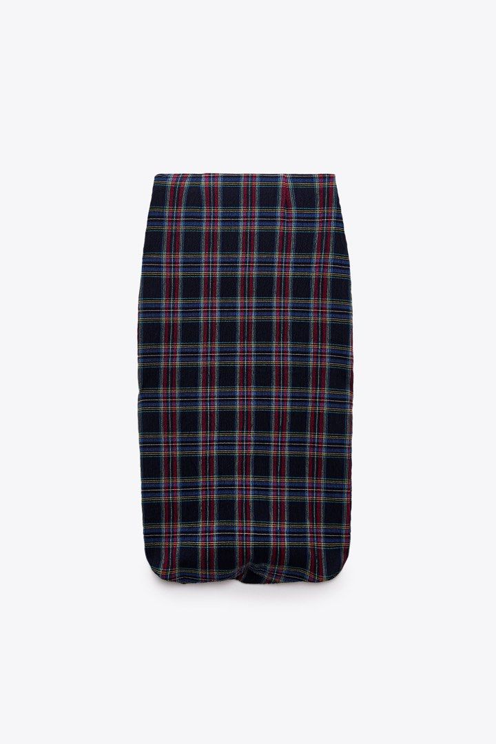 Zara Plaid Midi Skirt Size M (Category: Skirts) located in Bacolod City. Submitted by pym_shops (Listing ID 1442456055, Image 1). Description: - Zara midi skirt - Classic plaid pattern with navy, red, blue, and yellow checks - Slightly crinkled fabric texture - Estimated size: Medium - Versatile for casual and smart-casual outfits.