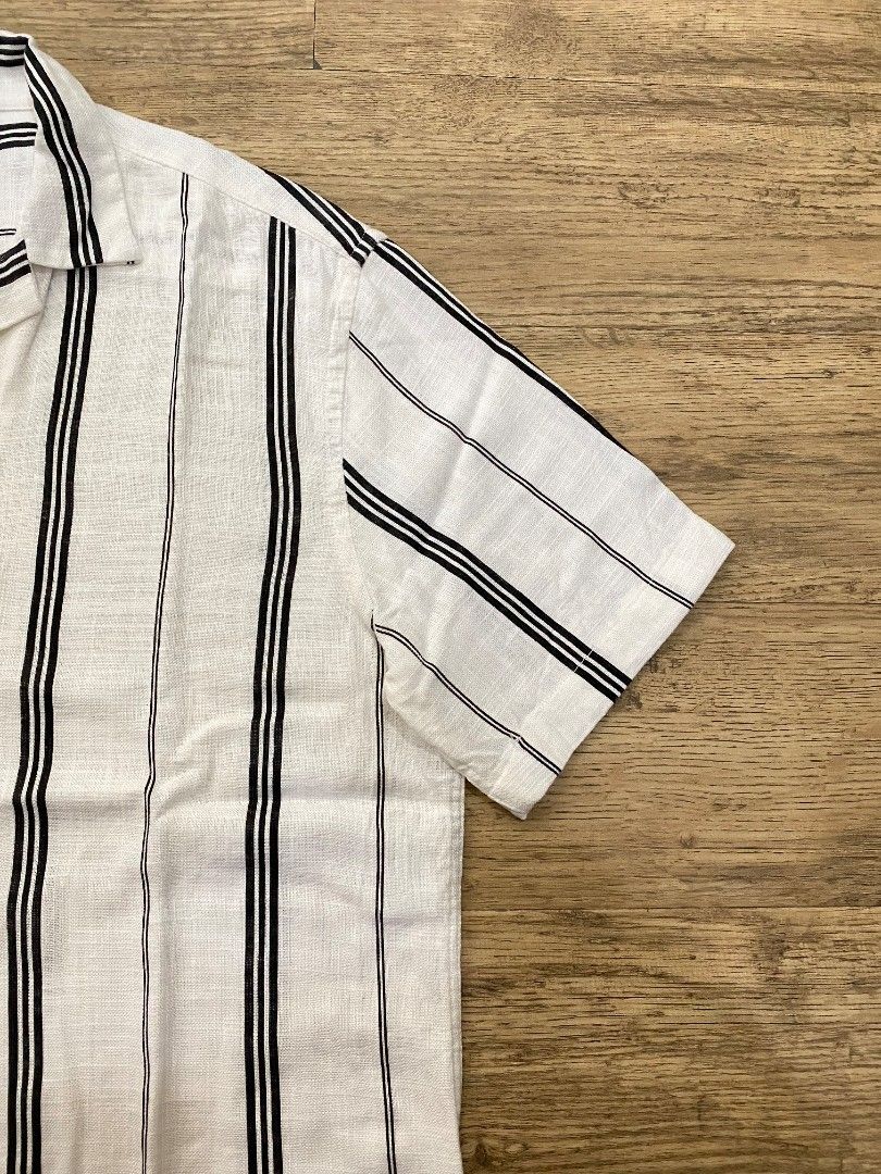 ZARA Striped Short Sleeve Shirt (Category: Tshirts & Polo Shirts ) located in Manila. Submitted by francloset_1 (Listing ID 1442489028, Image 2). Description: - White short-sleeve button-up shirt - Features black vertical stripes - Made from a comfortable linen-blend fabric - Ideal for casual outings or beach vacations - Breathable material - Tagged size M 23/28.5 no issue.