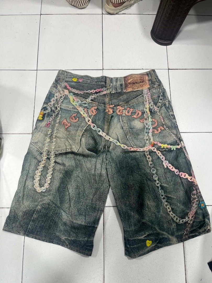 Acne Studios Distressed Denim Shorts with Chains & Charms (Category: Shorts) located in Quezon City. Submitted by mangthrift (Listing ID 1442683917, Image 2). Description: - Authentic Acne Studios distressed denim shorts - Unique all-over chain and charm embellishments - Classic button fly closure - Perfect statement piece to elevate your style Dimes Waist: 38inches Long:29inches.