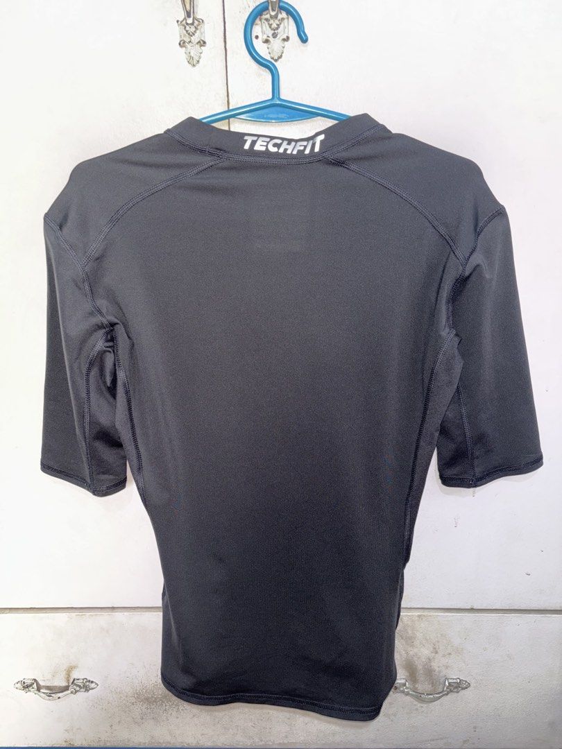 Adidas Techfit Compression 3/4 Sleeve Top Climalite Black (Category: Activewear) located in Pasig City. Submitted by timmybatoon (Listing ID 1442640946, Image 2). Description: - Black Adidas Techfit compression top - 3/4 sleeves - Climalite fabric for sweat-wicking - Ideal for workouts or as a base layer - Comfortable and supportive fit - Features Adidas logo and Techfit branding.