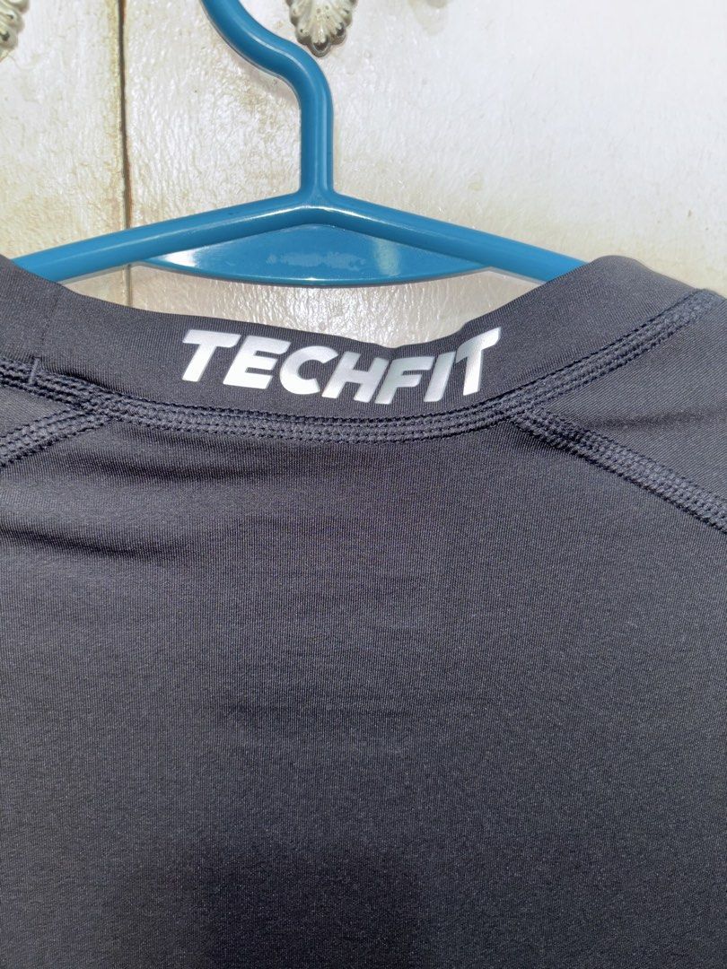 Adidas Techfit Compression 3/4 Sleeve Top Climalite Black (Category: Activewear) located in Pasig City. Submitted by timmybatoon (Listing ID 1442640946, Image 3). Description: - Black Adidas Techfit compression top - 3/4 sleeves - Climalite fabric for sweat-wicking - Ideal for workouts or as a base layer - Comfortable and supportive fit - Features Adidas logo and Techfit branding.