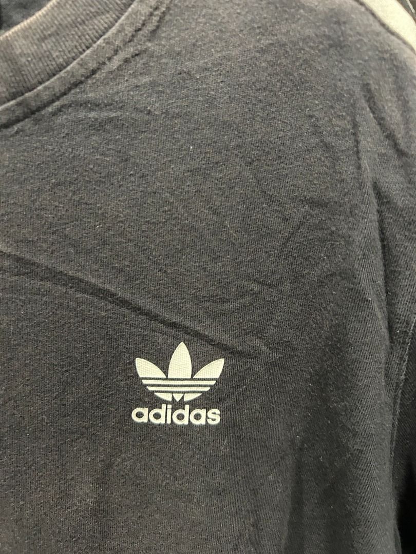 Adidas Tee - Multi-Size (US/JP XL) Vintage (Category: Tshirts & Polo Shirts ) located in Quezon City. Submitted by atienzavee (Listing ID 1442579016, Image 2). Description: Vintage adidas tee with multiple size tags: Asia L, AU M, US/JP XL. 27.5"L x 20"W. Classic sportswear style. 📏 Measurements: - Size on tag: Asia L, AU/NZ M, US/JP XL - Length: 27.5 in - Width: 20 in 📝 Notes: - Multiple size conventions, authenticity not validated.