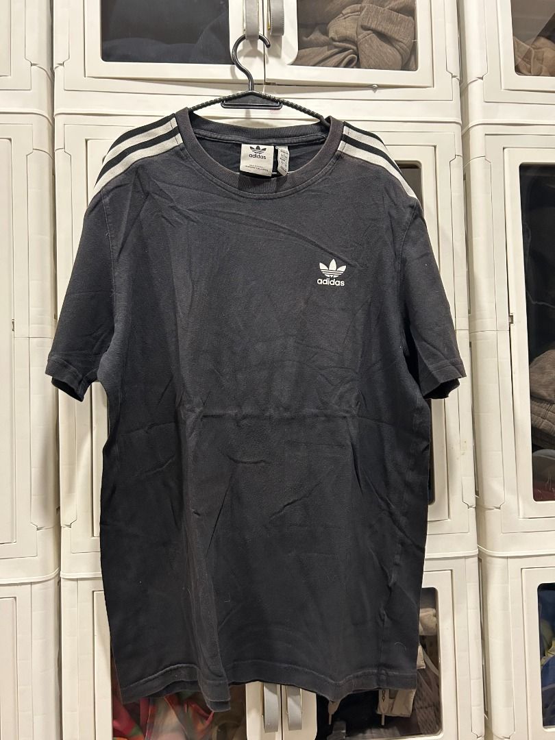 Adidas Tee - Multi-Size (US/JP XL) Vintage (Category: Tshirts & Polo Shirts ) located in Quezon City. Submitted by atienzavee (Listing ID 1442579016, Image 1). Description: Vintage adidas tee with multiple size tags: Asia L, AU M, US/JP XL. 27.5"L x 20"W. Classic sportswear style. 📏 Measurements: - Size on tag: Asia L, AU/NZ M, US/JP XL - Length: 27.5 in - Width: 20 in 📝 Notes: - Multiple size conventions, authenticity not validated.