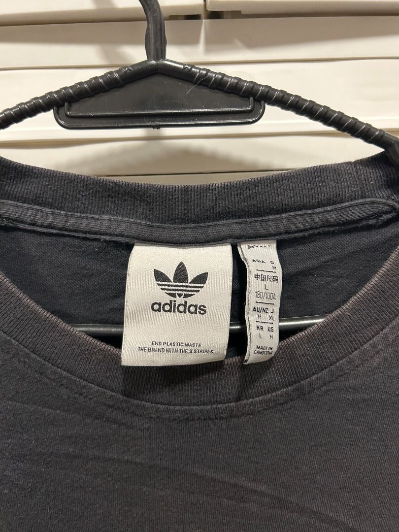 Adidas Tee - Multi-Size (US/JP XL) Vintage (Category: Tshirts & Polo Shirts ) located in Quezon City. Submitted by atienzavee (Listing ID 1442579016, Image 3). Description: Vintage adidas tee with multiple size tags: Asia L, AU M, US/JP XL. 27.5"L x 20"W. Classic sportswear style. 📏 Measurements: - Size on tag: Asia L, AU/NZ M, US/JP XL - Length: 27.5 in - Width: 20 in 📝 Notes: - Multiple size conventions, authenticity not validated.