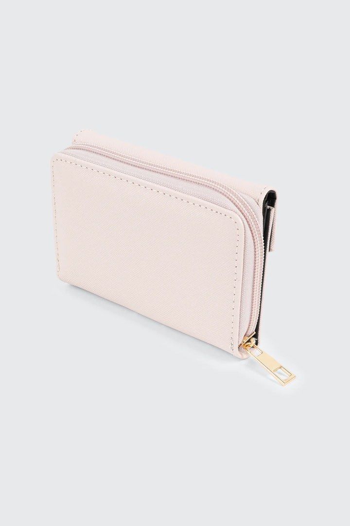 Ardene Pink Tri-Fold Wallet with Gold Accent (Category: Wallets & Card holders) located in Quezon City. Submitted by GlamourD (Listing ID 1442625612, Image 2). Description: - Cute pink tri-fold wallet from Ardene - Features a stylish gold bar detail on the front flap - Secure zipper closure on the side - Interior includes card slots and a clear ID window - Perfect for keeping your essentials organized - Small and compact design, fits easily in an