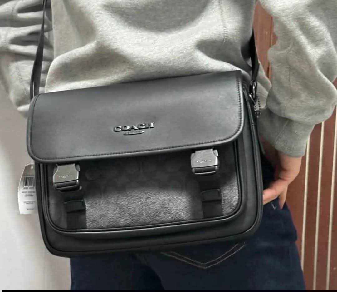 Coach Racer Messenger men bag (Category: Luxury Bags & Wallets) located in Manila. Submitted by yukionnana (Listing ID 1442687575, Image 1). Description: AUTHENTIC COACH 100% Authentic Coach -Made in Vietnam / Japan Import Price ₱4,499 + shipping fee This Coach Racer Messenger Bag is crafted from charcoal signature coated canvas and smooth black leather, featuring a distinct speedclip closure. ✅bulk's orders with discount 😍 ✅ BRAND NEW ✅ 100% Au