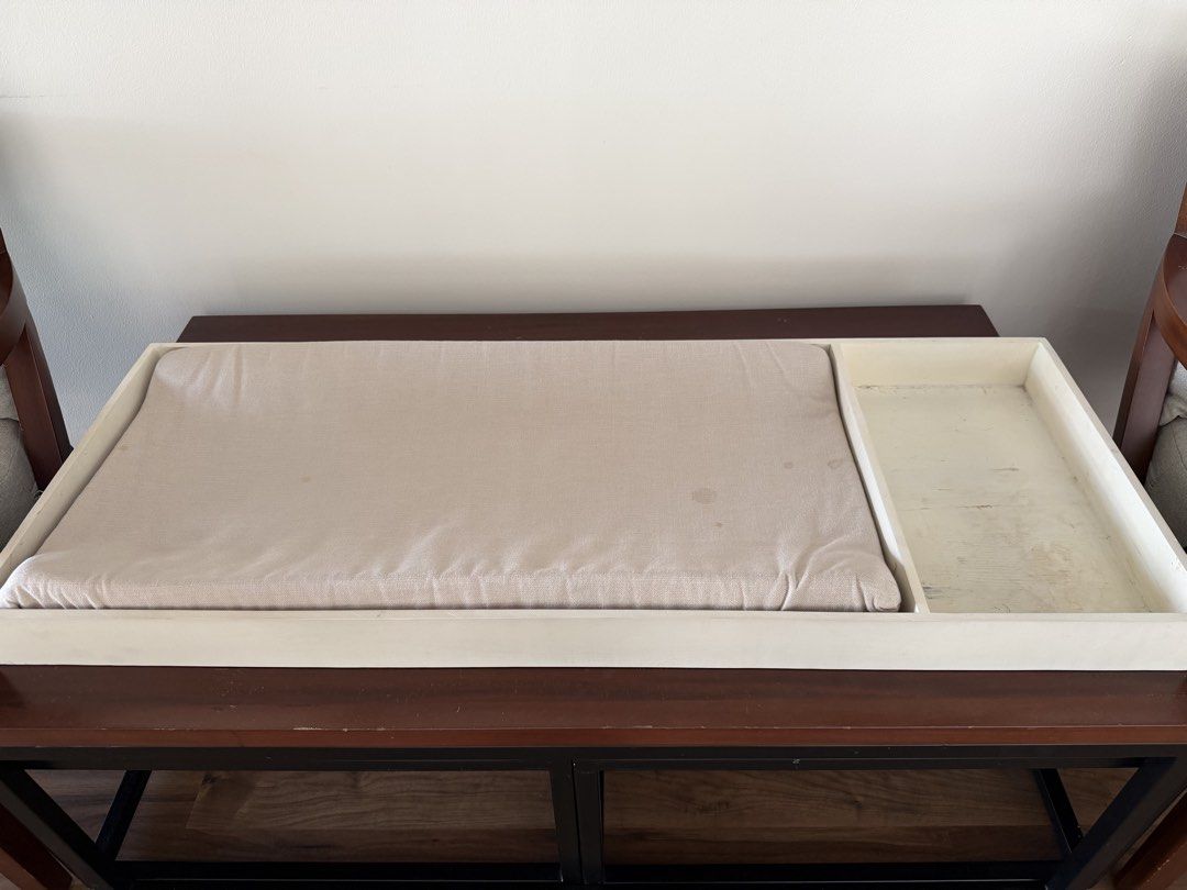 Baby Changing Pad Tray with Storage Compartment (Category: Changing Mats & Accessories) located in Caloocan City. Submitted by andreayap35789 (Listing ID 1442584665, Image 2). Description: - Cream wooden changing pad tray with cushioned changing pad. - Minor marks present on pad and inside tray. - Perfect for organizing baby essentials during diaper changes. - Designed to fit most standard changing pads..