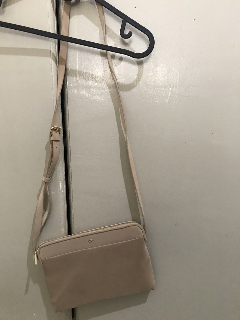 Beige Crossbody Bag (Parfois) (Category: Cross-body Bags) located in Pasig City. Submitted by njademb (Listing ID 1442582798, Image 1). Description: - beige crossbody bag - Adjustable strap (minor marks as pictured) - only used once. Marks could be from the storage. - last price posted RFS: decluttering.