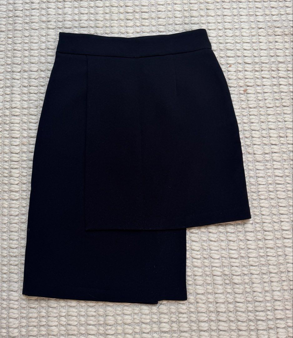 Black Asymmetrical Pencil Skirt (Category: Skirts) located in Paranaque City. Submitted by migvee (Listing ID 1442575736, Image 2). Description: - Brand: DF Dress Lab - Color: Black - Style: Asymmetrical Pencil Skirt - Material: 100% Polyester - Features: Unique overlapping design - Versatility: Great for dressing up or down, easy to pair with various tops - Aesthetic: Sharp, modern, and chic.