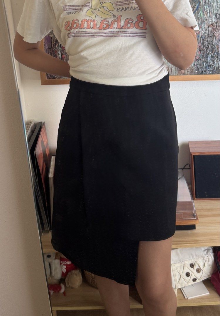 Black Asymmetrical Pencil Skirt (Category: Skirts) located in Paranaque City. Submitted by migvee (Listing ID 1442575736, Image 1). Description: - Brand: DF Dress Lab - Color: Black - Style: Asymmetrical Pencil Skirt - Material: 100% Polyester - Features: Unique overlapping design - Versatility: Great for dressing up or down, easy to pair with various tops - Aesthetic: Sharp, modern, and chic.