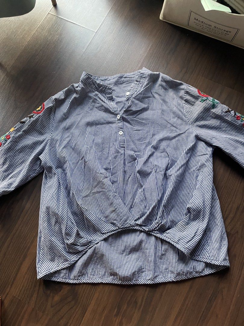 Blue Gingham Flower embroidered Blouse (Category: Blouses) located in Quezon City. Submitted by andreaaa_______ (Listing ID 1442564249, Image 1). Description: - Cute blue and white gingham pattern high low detail - Beautiful colorful floral embroidery on sleeves - Classic mandarin collar with button-up front no size or tag fits s-m frames.