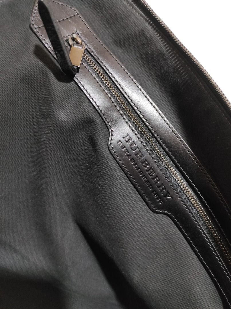 Burberry Haymarket Document Portfolio (Category: Luxury Bags & Wallets) located in Pasay City. Submitted by highkeys (Listing ID 1442681109, Image 3). Description: - Classic Burberry Haymarket check pattern - Genuine leather trim - Secure zip closure - Interior cardholder section - Ideal for carrying essentials - Dimensions: length 15" x width 11.5".