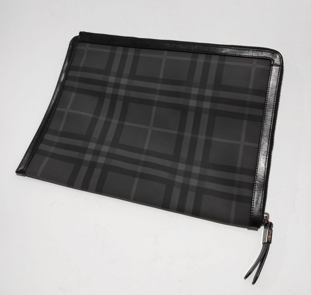 Burberry Haymarket Document Portfolio (Category: Luxury Bags & Wallets) located in Pasay City. Submitted by highkeys (Listing ID 1442681109, Image 2). Description: - Classic Burberry Haymarket check pattern - Genuine leather trim - Secure zip closure - Interior cardholder section - Ideal for carrying essentials - Dimensions: length 15" x width 11.5".