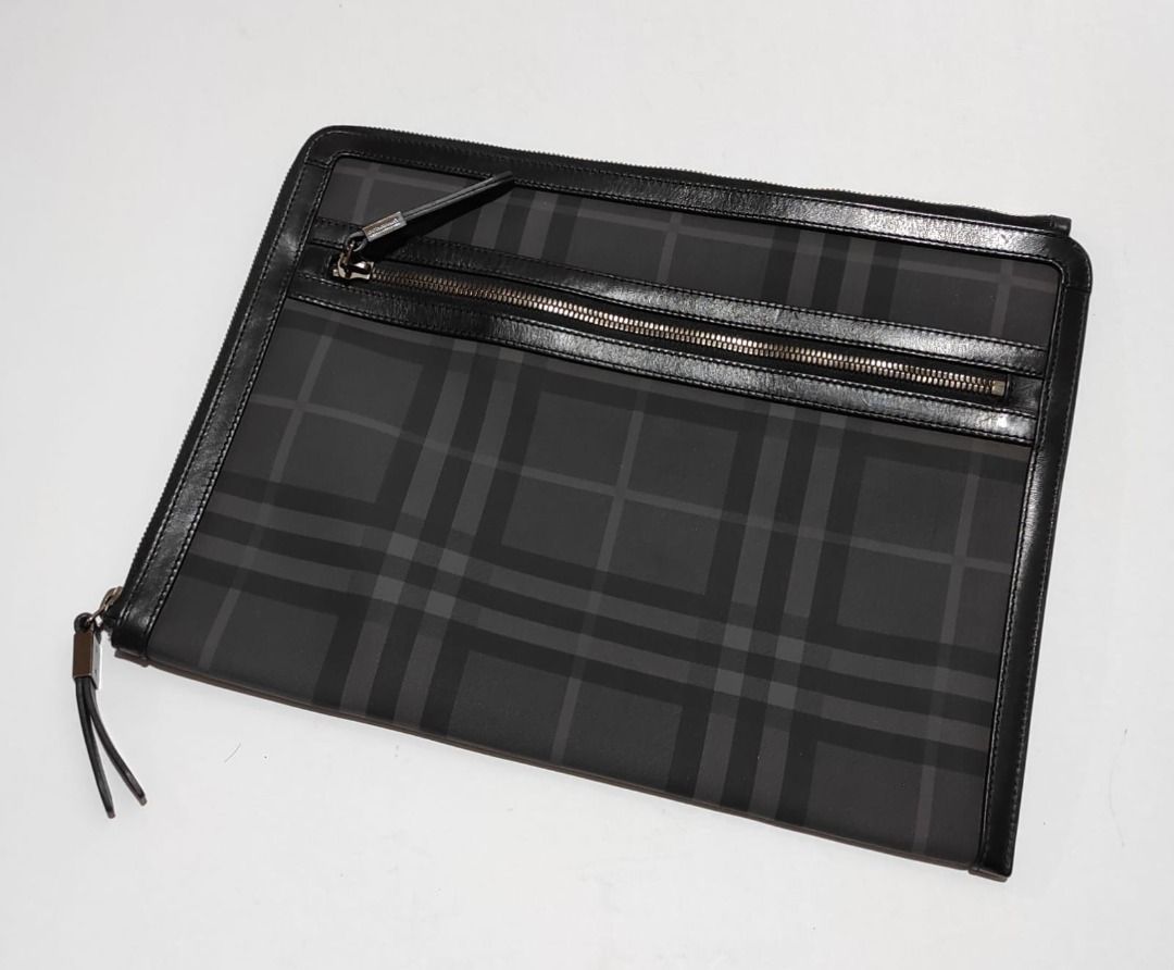 Burberry Haymarket Document Portfolio (Category: Luxury Bags & Wallets) located in Pasay City. Submitted by highkeys (Listing ID 1442681109, Image 1). Description: - Classic Burberry Haymarket check pattern - Genuine leather trim - Secure zip closure - Interior cardholder section - Ideal for carrying essentials - Dimensions: length 15" x width 11.5".