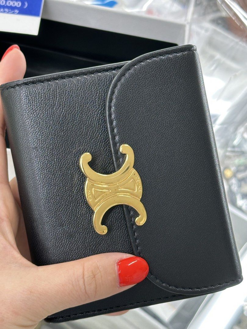 Celine Triomphe Wallet Black Leather Gold Hardware (Category: Luxury Bags & Wallets) located in Quezon City. Submitted by dearmaryclothing (Listing ID 1442609424, Image 3). Description: - Authentic Celine wallet sourced from vintage shop in Japan (check my ig shop @dearmaryshop) - Black leather with iconic gold Triomphe clasp - Small size, perfect for pockets or small bags - Comes with original dust bag and box - Ideal for carrying essentials.